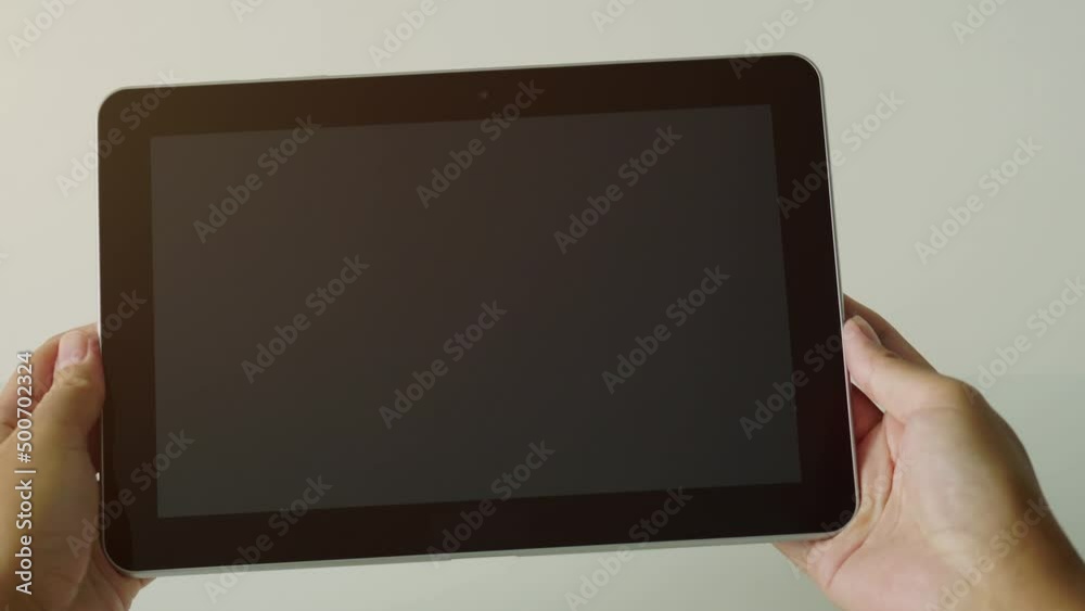 hand holding digital tablet hand holding digital tablet
