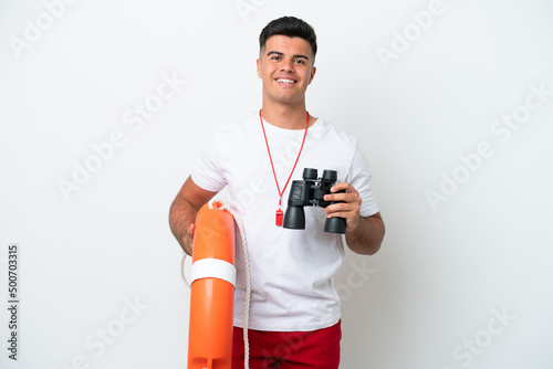 Young handsome man isolated on white background with lifeguard equipment and with binoculars