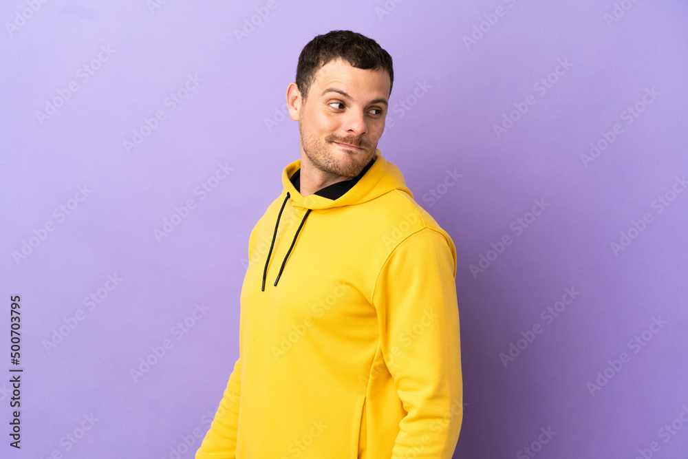 Brazilian man over isolated purple background . Portrait Brazilian man over isolated purple background . Portrait