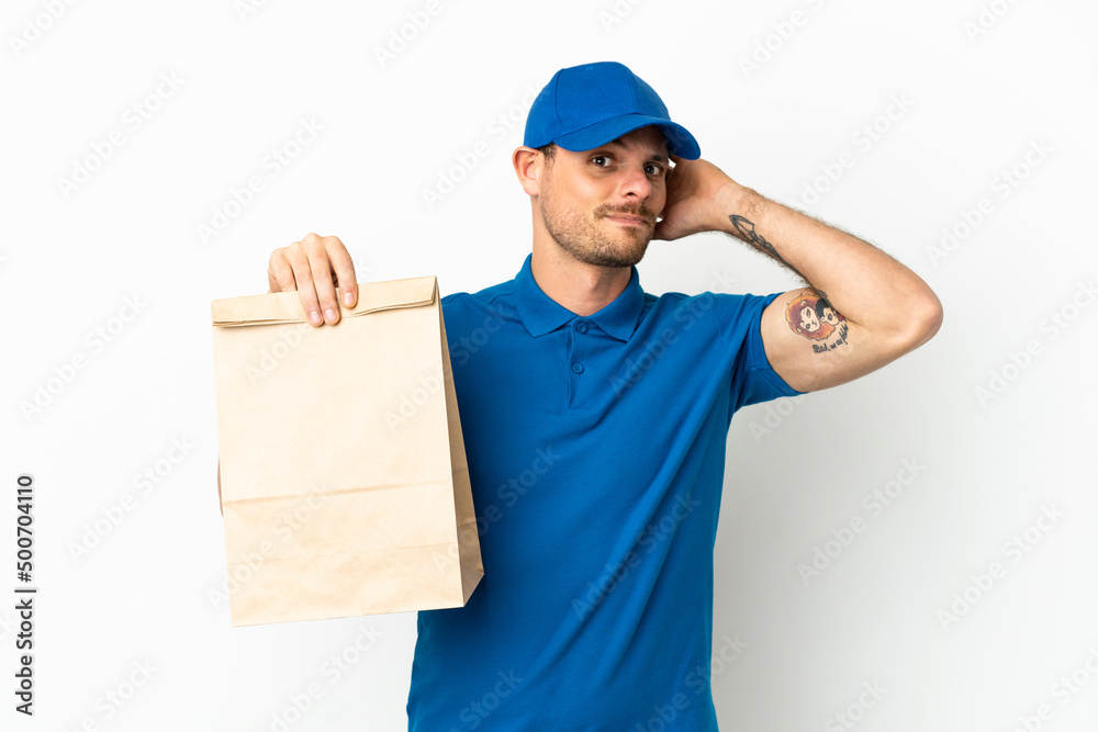 Brazilian taking a bag of takeaway food isolated on white background having doubts Brazilian taking a bag of takeaway food isolated on white background having doubts