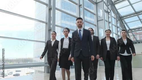 Portrait of business people team standing with arms crossed in office