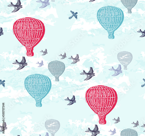 Seamless vintage style hot air balloon sky scenery with birds and planes. Collage and relief printmaking, stamp and block print effects.  photo