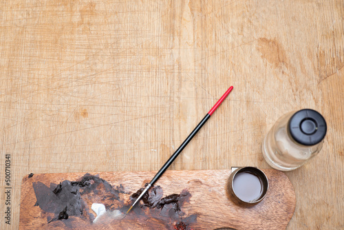 Artist's tools. Brush, paint, water bottle.