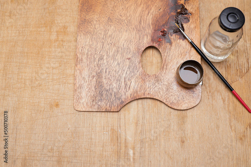 Artist's tools. Brush, paint, water bottle.
