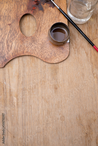 Artist's tools. Brush, paint, water bottle.