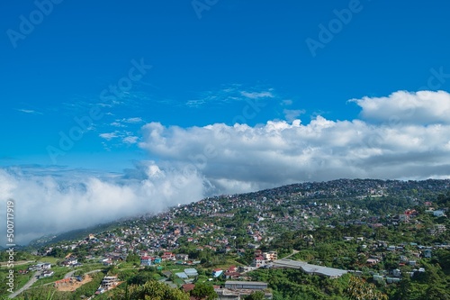 Highland landscape view of Baguio, Philippines with clouds in the blue sky