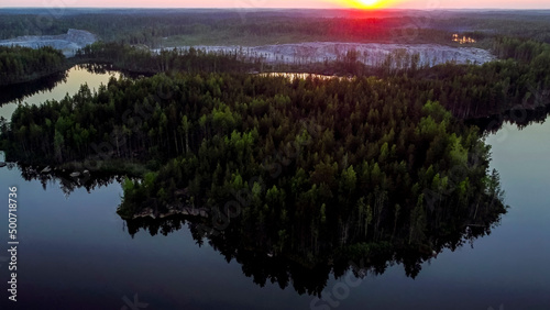 Flight over lakes and forests in Karelia near the village of Kuznechnoye in Russia. photo