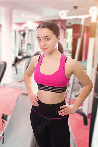 young girl at the gym in a fitness outfit
