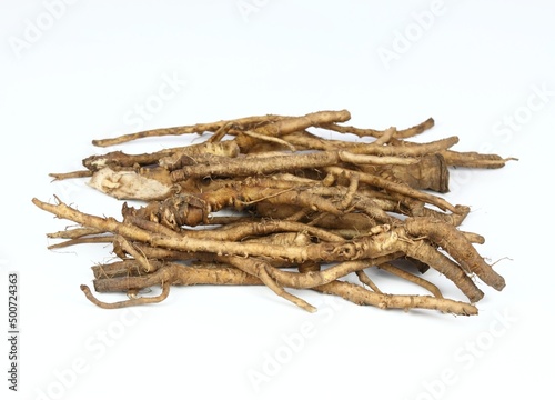 Fresh dandelion roots, lat.Taraxacum officinale on white. Very good for detoxication and healthy liver.