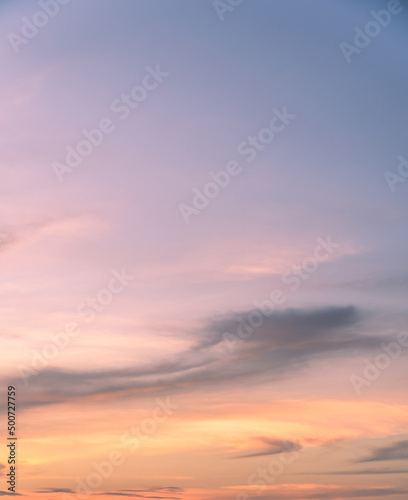 sunset sky vertical in the evening with orange sunlight clouds 