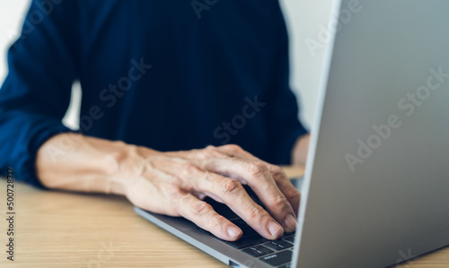 Businessperson or student working or studying with laptop or computer