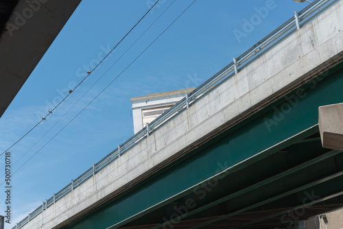 overpass and sky with birds on a wire