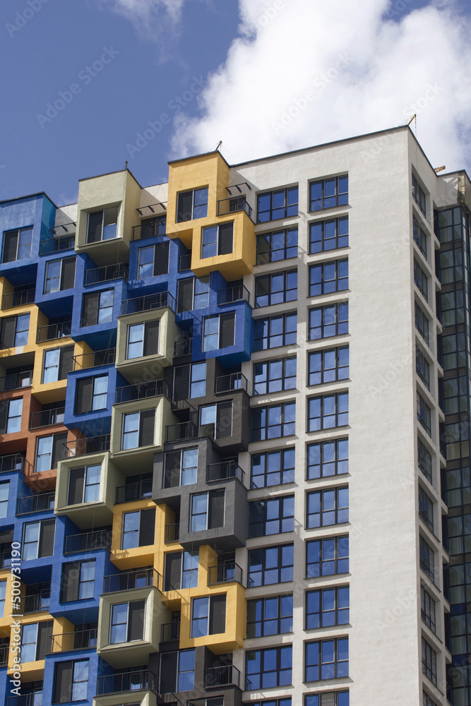 Construction of multi-storey buildings. Modern multi-storey building. Houses built of concrete and glass. Construction of multi-storey buildings. Modern multi-storey building. Houses built of concrete and glass.