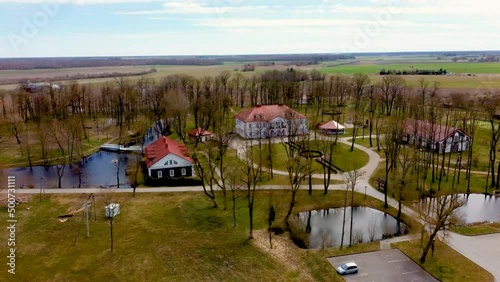 Amazing Aerial View Bistrampolis Palace and Parkin Lithuania, Panevezys District. Historic Palace in the Neoclassical Style. 4K UHD Resolution
 photo