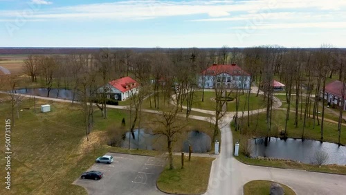 Amazing Aerial View Bistrampolis Palace and Parkin Lithuania, Panevezys District. Historic Palace in the Neoclassical Style. 4K UHD Resolution
 photo