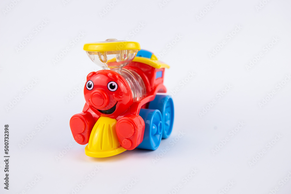 Fototapeta premium a children's plastic toy steam locomotive on a white background