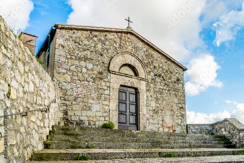 The tiny church of Saint Michael the Archangel in the town of Micciano, diocese of Volterra, municipality of Pomarance, province of Pisa, Tuscany region, Italy photo