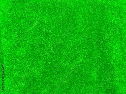 green velvet fabric texture used as background. Empty green fabric background of soft and smooth textile material. There is space for text..