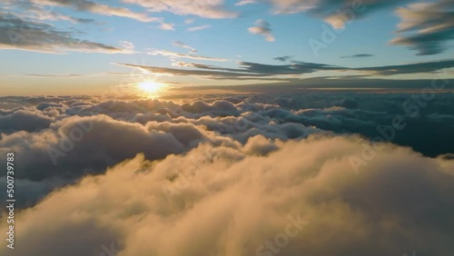 Sunlighten cumulus clouds under horizon. over the cumulus clouds in the morning. photo