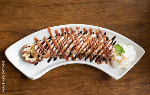 Ice cream vanilla with banana topping.