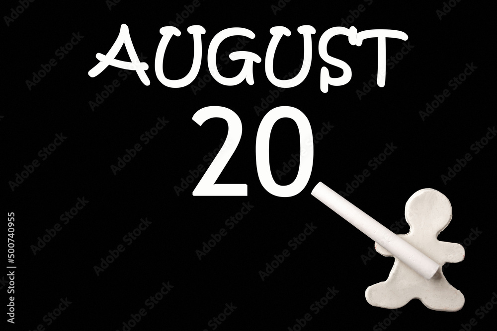 A small white plasticine man writing the date 20 August on a black board. Business concept. Education concept. A small white plasticine man writing the date 20 August on a black board. Business concept. Education concept.