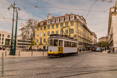 A view of public transport in a square in the Bairro Alto distict in the city of Lisbon on a spring day