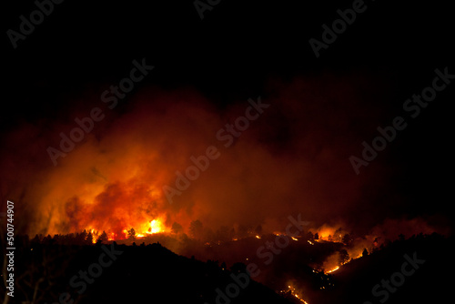 Flames and smoke on the mountain side at the Indian Gulch Fire. March 3rd, 2011 in Golden, Colorado.