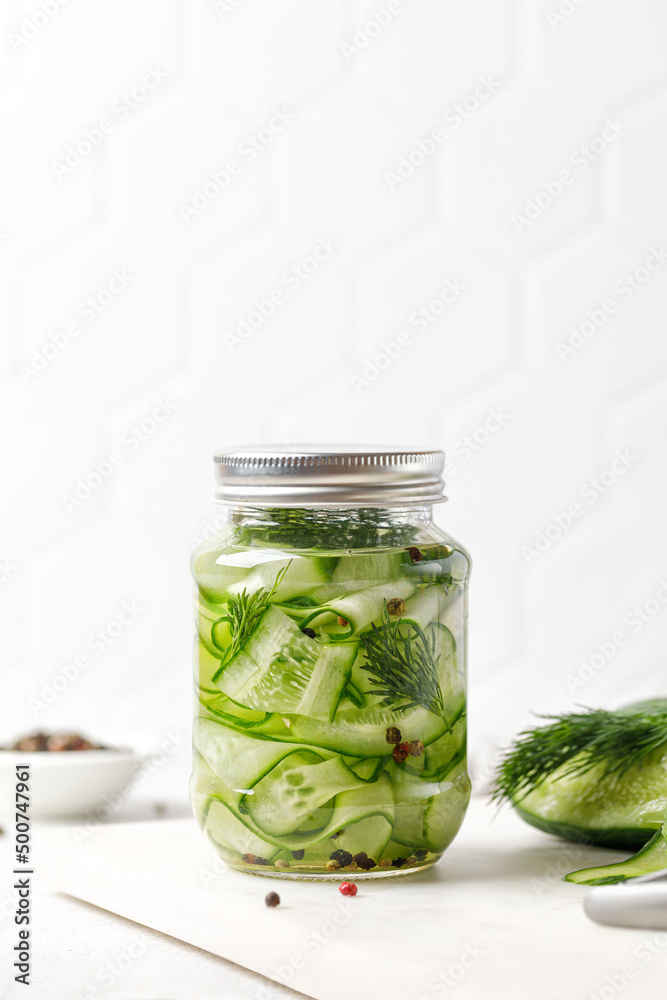 Jar of Pickled cucumbers. Slices of Marinated cucumbers in glass jars. Homemade fermented cucumbers. Jar of Pickled cucumbers. Slices of Marinated cucumbers in glass jars. Homemade fermented cucumbers.