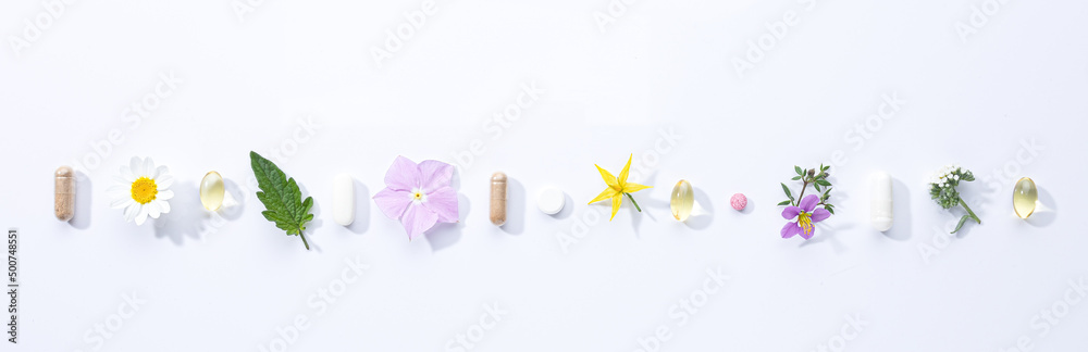 Vitamin capsules and dietary supplements isolated on with background . Panoramic format. Vitamin capsules and dietary supplements isolated on with background . Panoramic format.