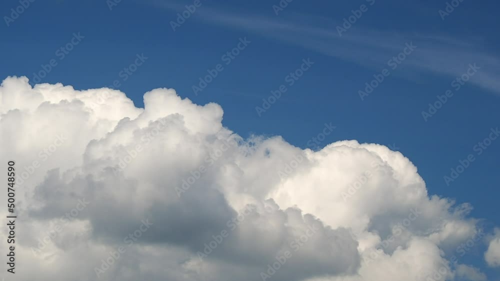 Huge heap bright white cloud moving on the blue sky Huge heap bright white cloud moving on the blue sky