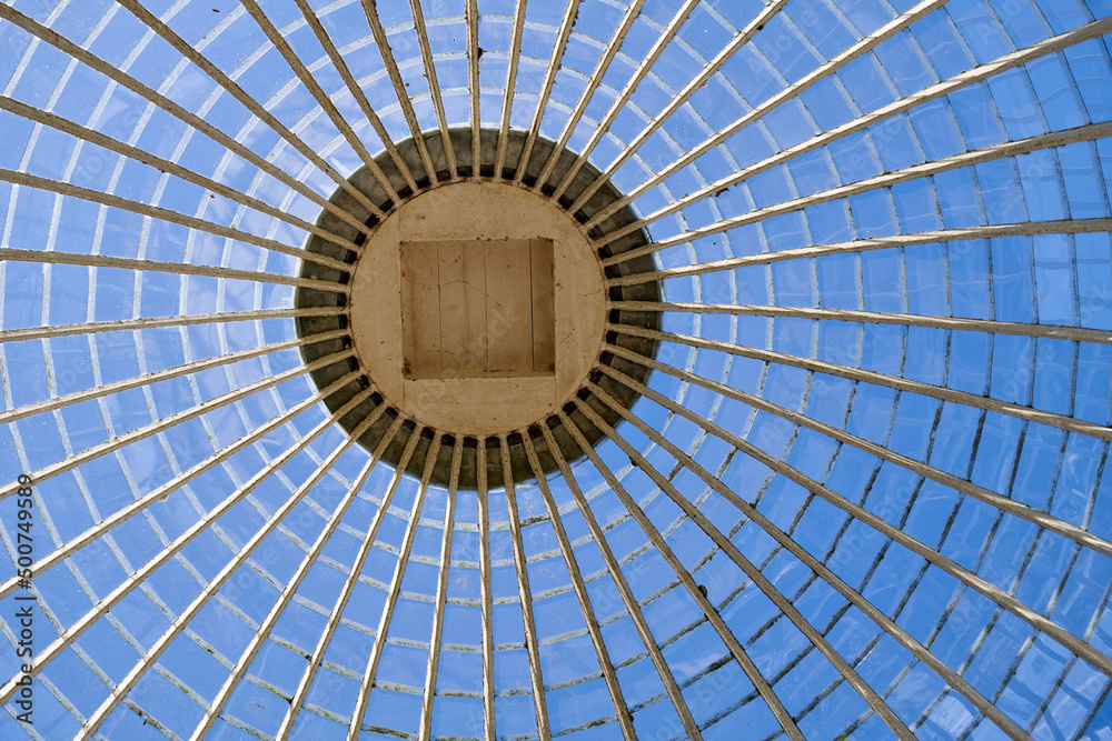 Looking upwards inside a glass frame dome