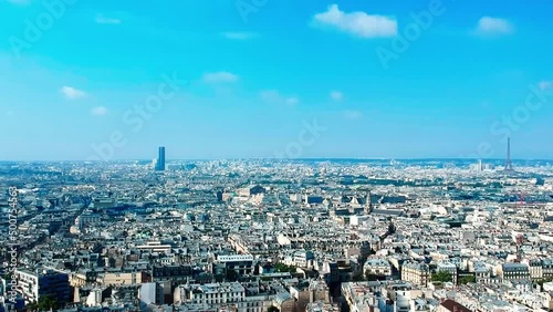 Aerial view of the roofs of Paris, with the Eiffel Tower, the Montparnasse Tower and the Opera