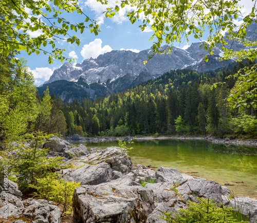 idyllic lake Frillensee Grainau, view to Zugspitze mass at springtime, upper bavarian landscape photo