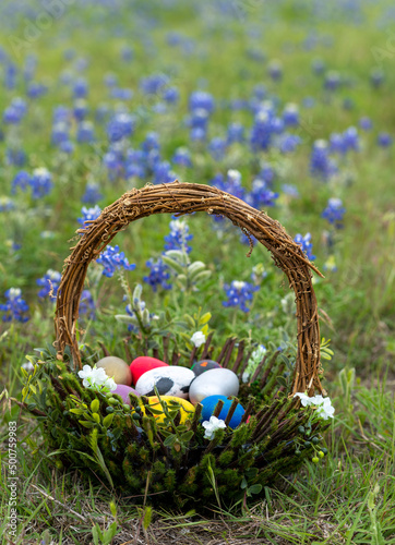 Easter Basket Resting on a Field of Bluebonnets flowers in Texas