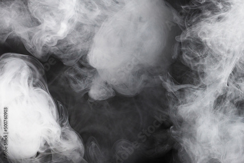 White steam on a black background.