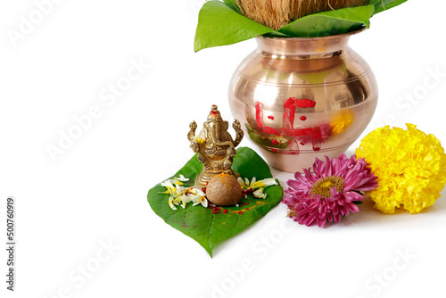 kalash pujan ganesha pujan Indian festival akshaya tritiya Decorative kalash with coconut and leaf with floral decoration photo