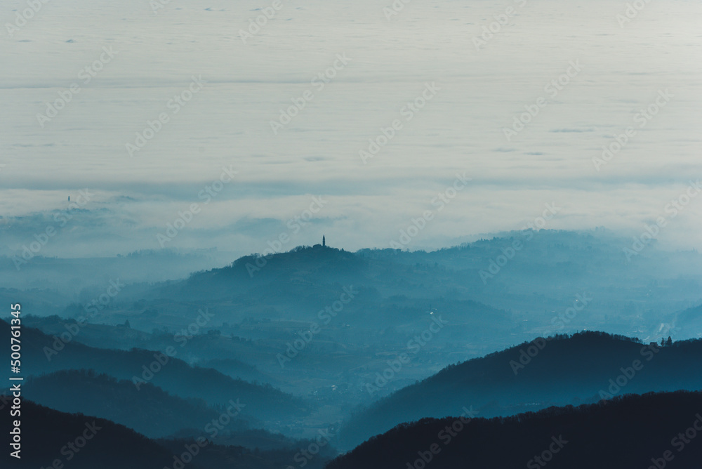 Fototapeta premium Foggy hills landscape in Italy
