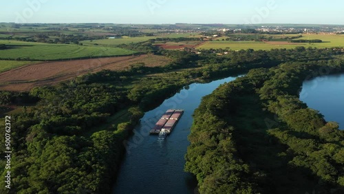 grain barge going up the tiete-parana waterway, on the tiete river photo