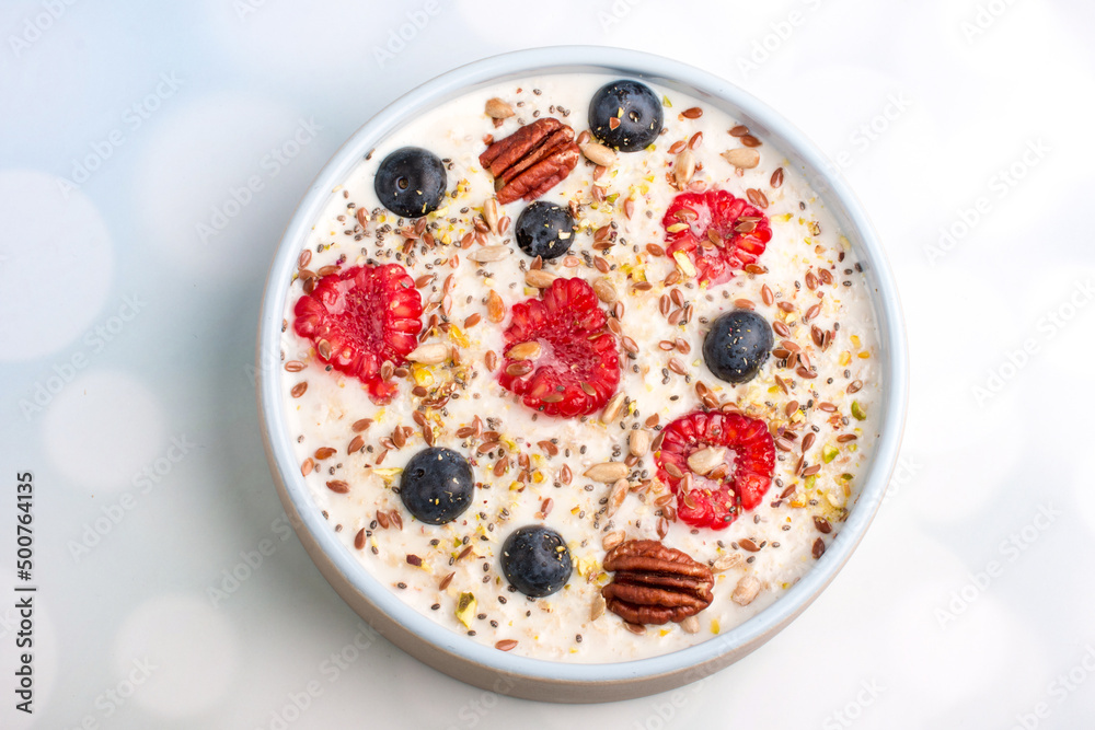 Oatmeal porridge with raspberries and blueberries. Vitamin breakfast Oatmeal porridge with raspberries and blueberries. Vitamin breakfast
