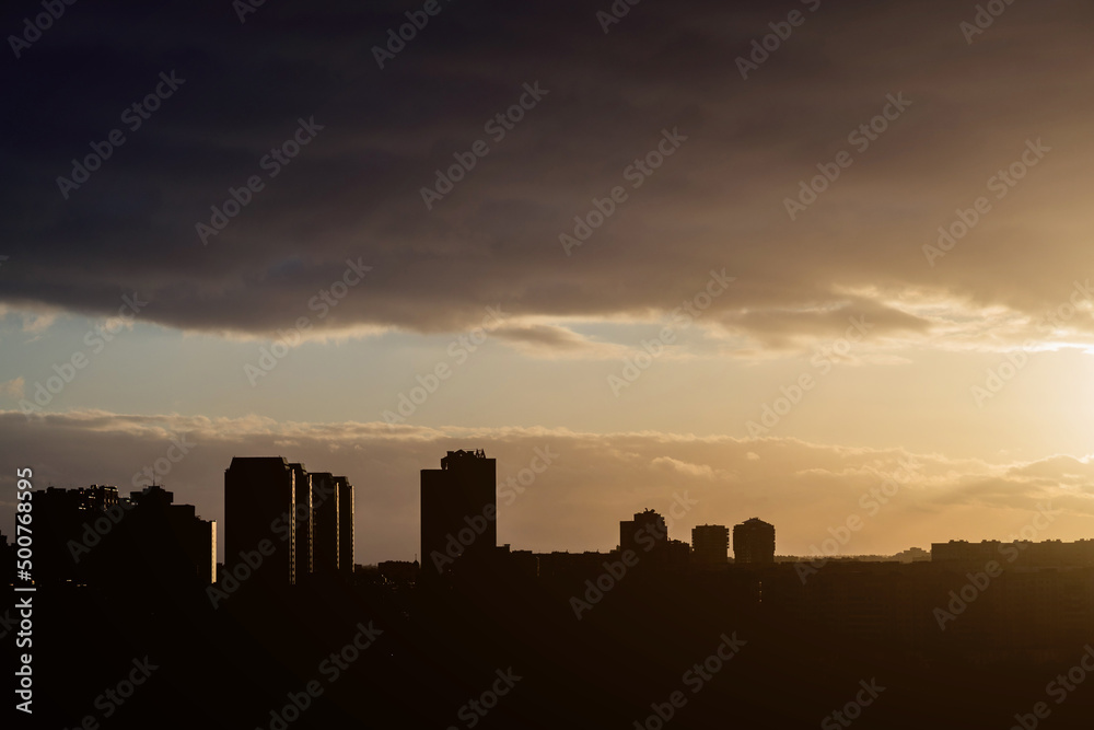 Silhouette shot of sunset over city