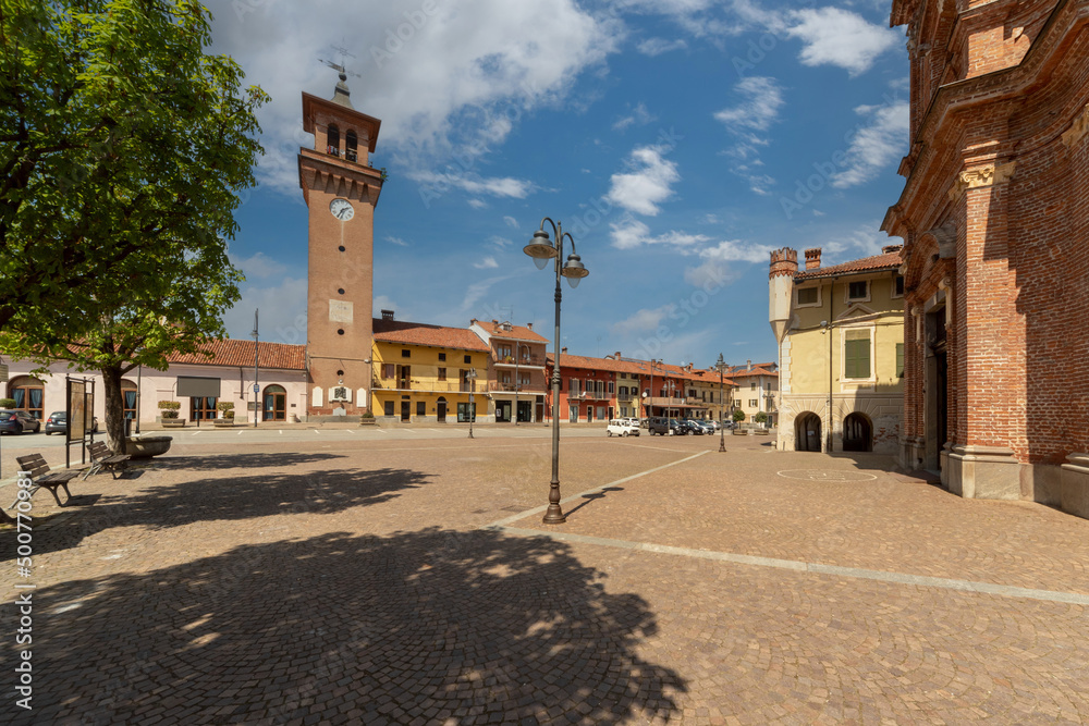 Villafalletto, Cuneo, Italy - April 15, 2022: piazza Giuseppe Mazzini, the central square of Villafalletto with the civic tower