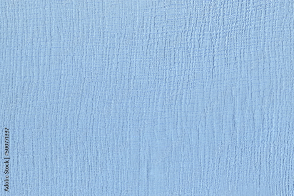 The texture of a light silk natural blue fabric. Abstract background of a light pleasant fabric with a special interweaving of threads. The texture of a light silk natural blue fabric. Abstract background of a light pleasant fabric with a special interweaving of threads.