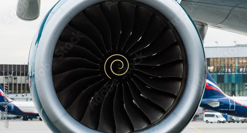Turbine engine of a modern jet passenger aircraft at an international airport.