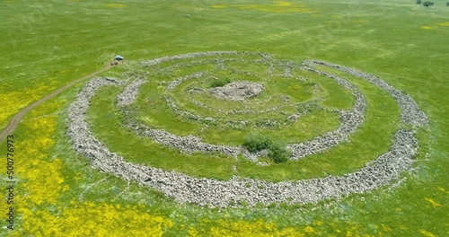 Aerial view of ancient megalithic monument in grassland, Rujum Al-Hiri, Golan Heights, Israel. photo