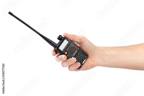 The hand of a man holding a walkie-talkie isolated on white background