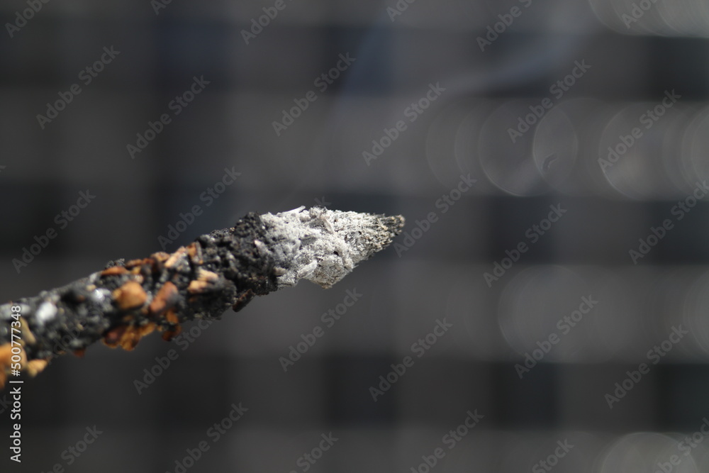 Incense burning against black background Incense burning against black background