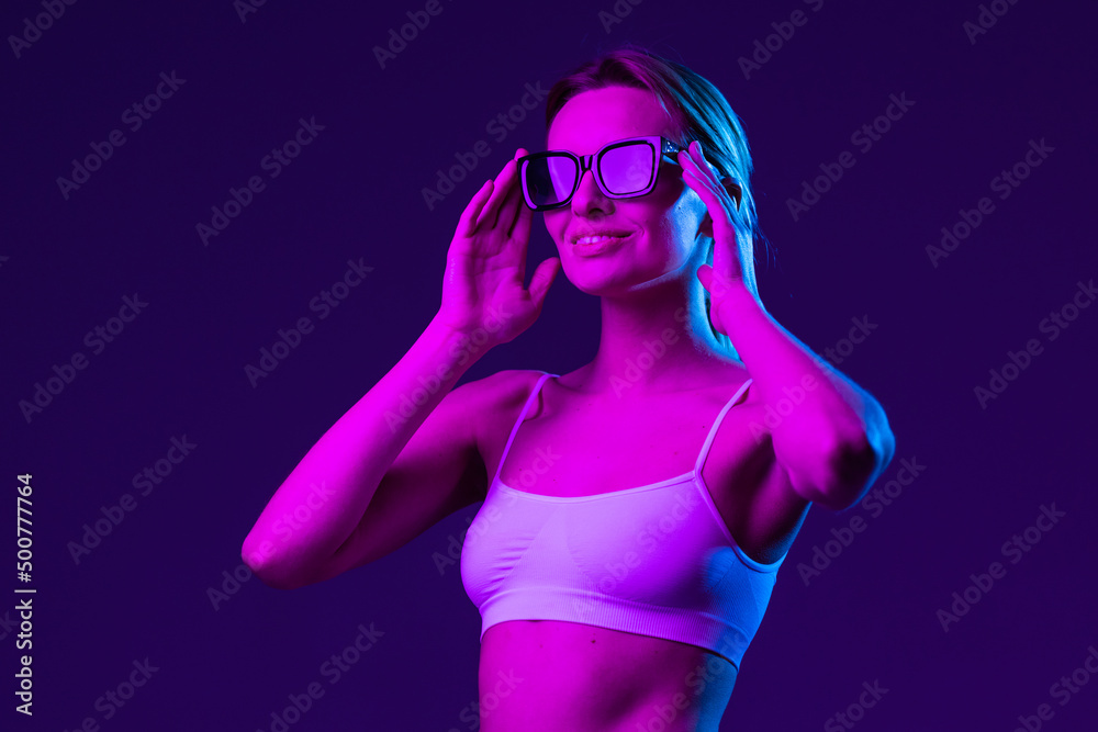 Fashion young woman wear stylish pink glasses looking at camera isolated on black studio background, horizontal banner for website design, Fashion young woman wear stylish pink glasses looking at camera isolated on black studio background, horizontal banner for website design,