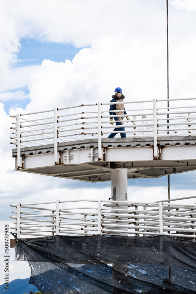 Working man walking on the bridge, Bogotá, Colombia. Working man walking on the bridge, Bogotá, Colombia.