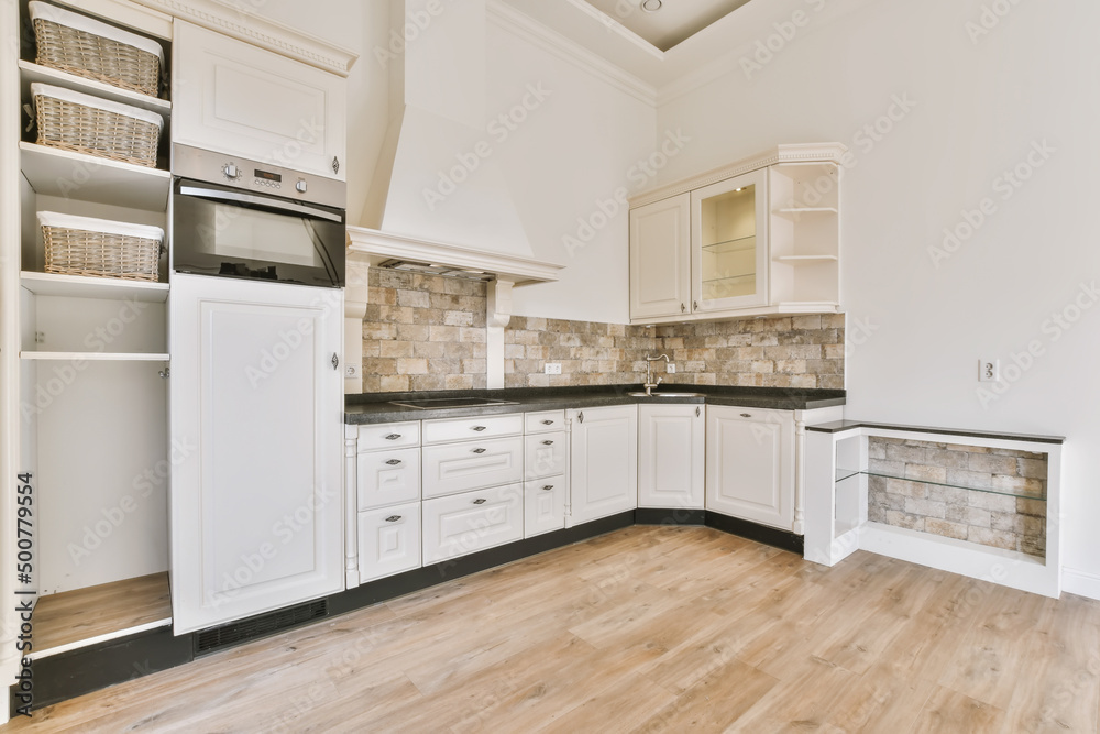 Kitchen with white furniture in apartment Kitchen with white furniture in apartment