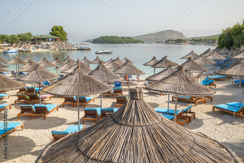Tableau sur toile Beautiful beach with umbrellas and sunbeds in Ksamil, Albania